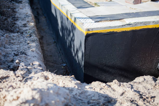 Professional Basement Waterproofing technician working in Clifton Springs, NY